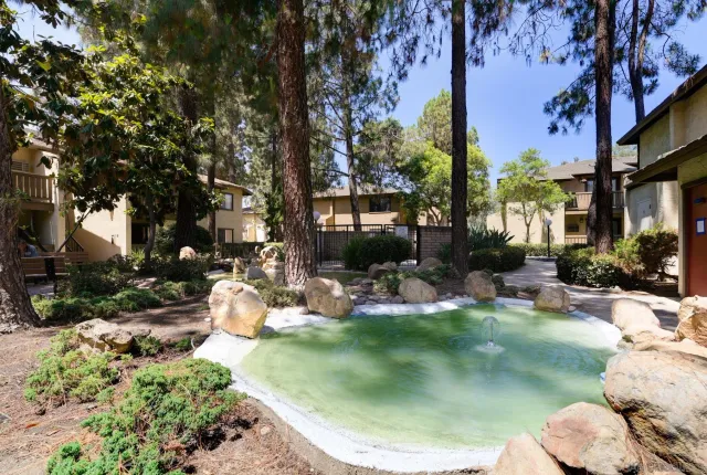 a view of a backyard with sitting area