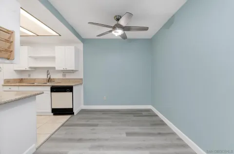 a kitchen with a sink cabinets and window