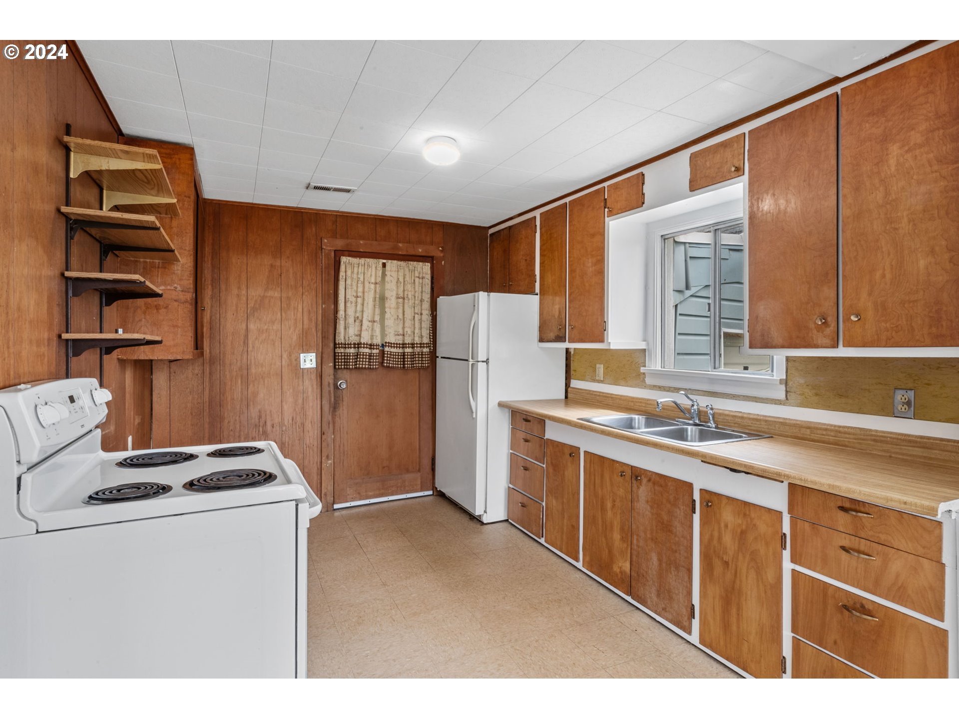 92165 Clover Road Astoria, OR 97103 - Photo 11 of 31 a kitchen with a refrigerator and a sink