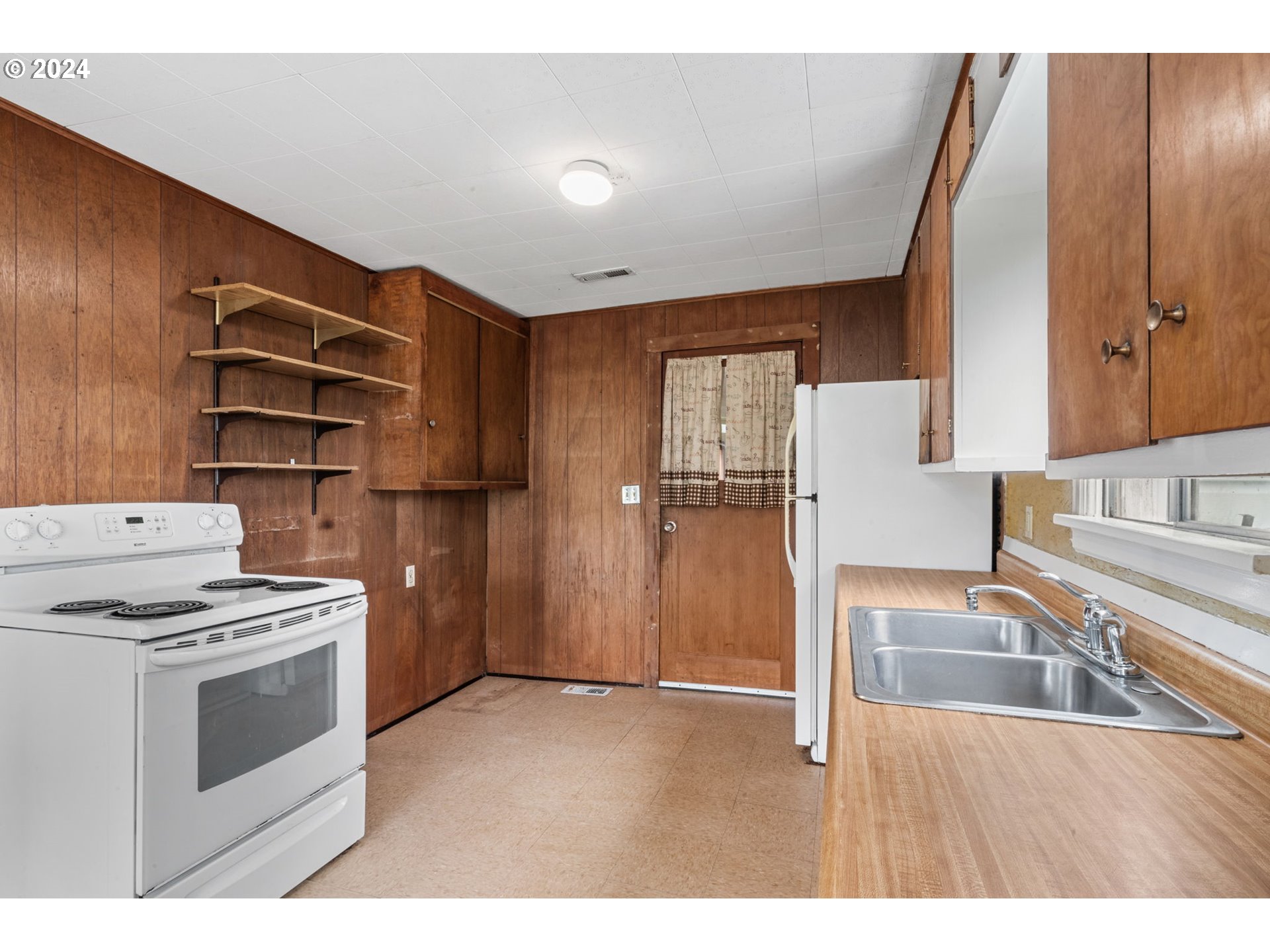 92165 Clover Road Astoria, OR 97103 - Photo 13 of 31 a kitchen with stainless steel appliances granite countertop a sink stove and refrigerator