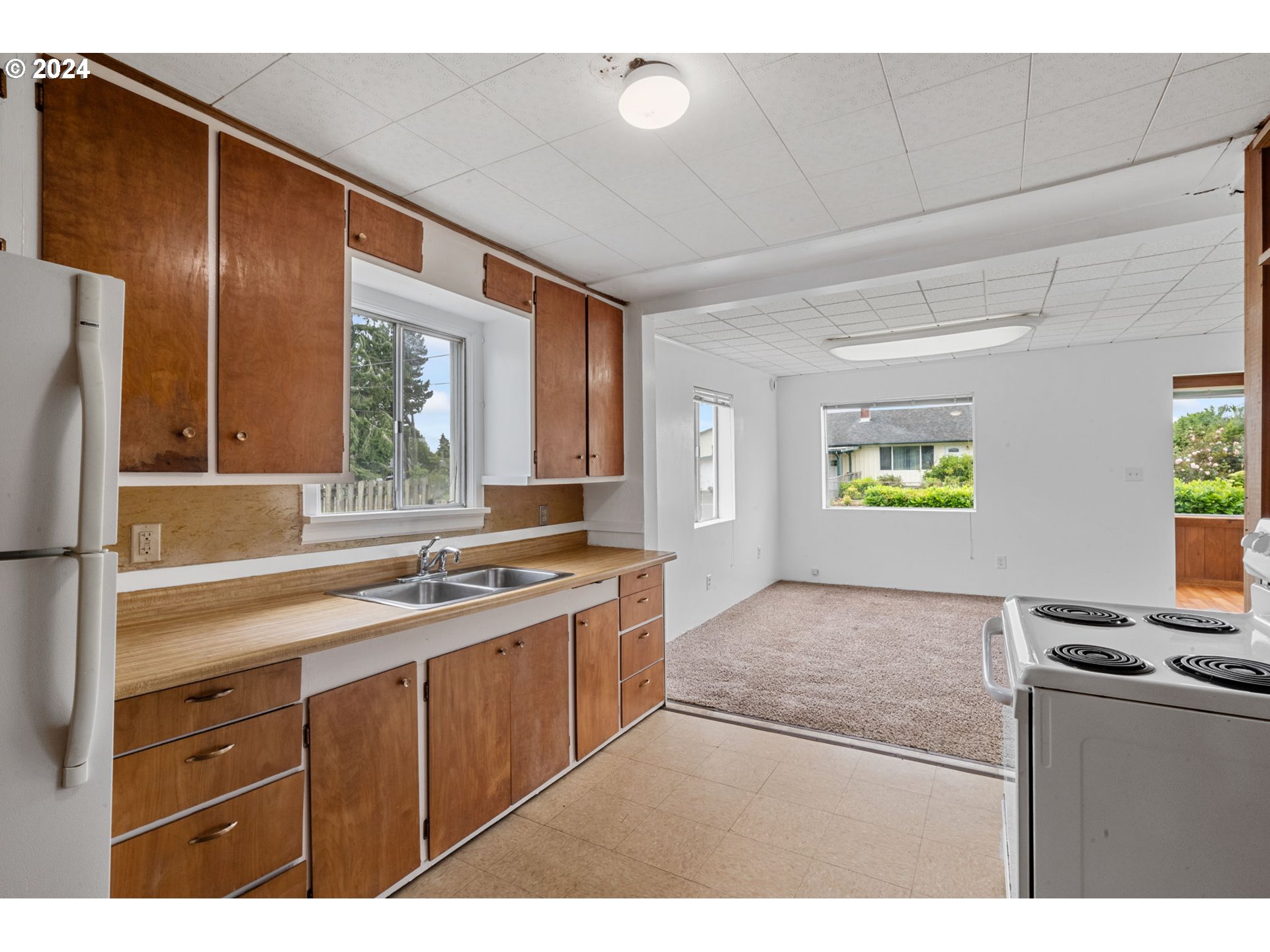 92165 Clover Road Astoria, OR 97103 - Photo 14 of 31 a kitchen with stainless steel appliances granite countertop a sink stove and refrigerator