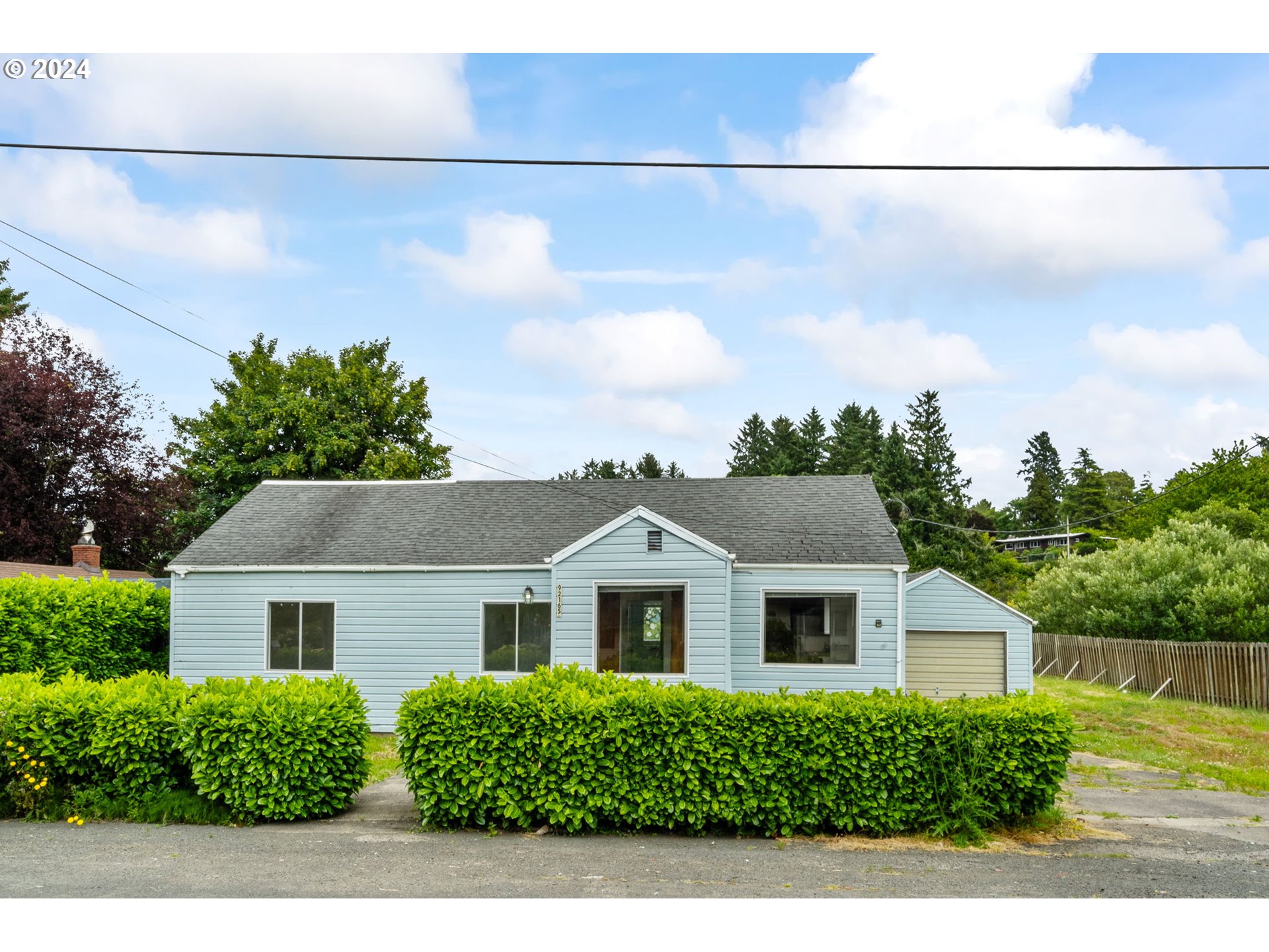 92165 Clover Road Astoria, OR 97103 - Photo 2 of 31 a front view of a house with a yard