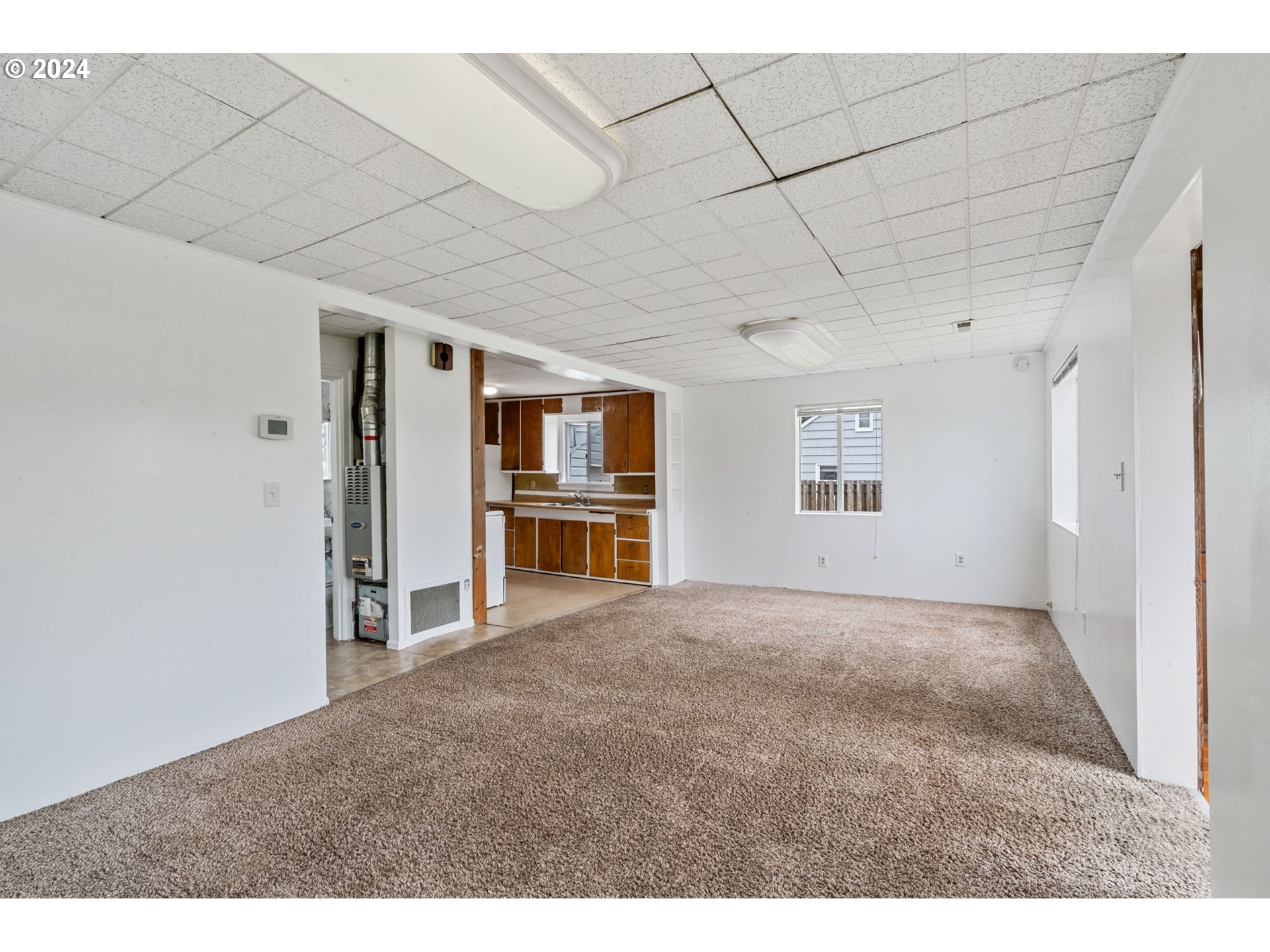 92165 Clover Road Astoria, OR 97103 - Photo 7 of 31 a view of a big room with wooden cabinet and windows
