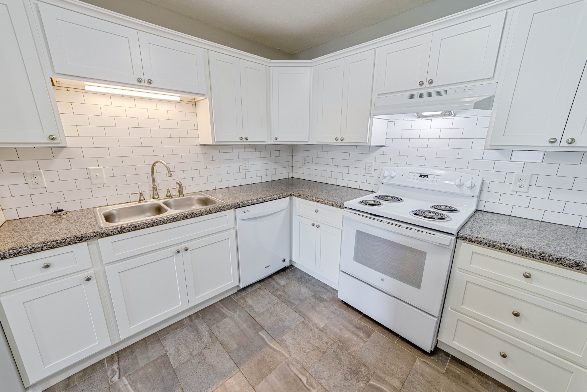 311 Hawkins Road, Unit O7 Clarksville, TN 37040 - Photo 9 of 17 a kitchen with granite countertop white cabinets and white appliances