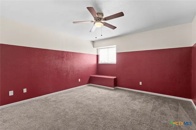 a room with table and ceiling fan