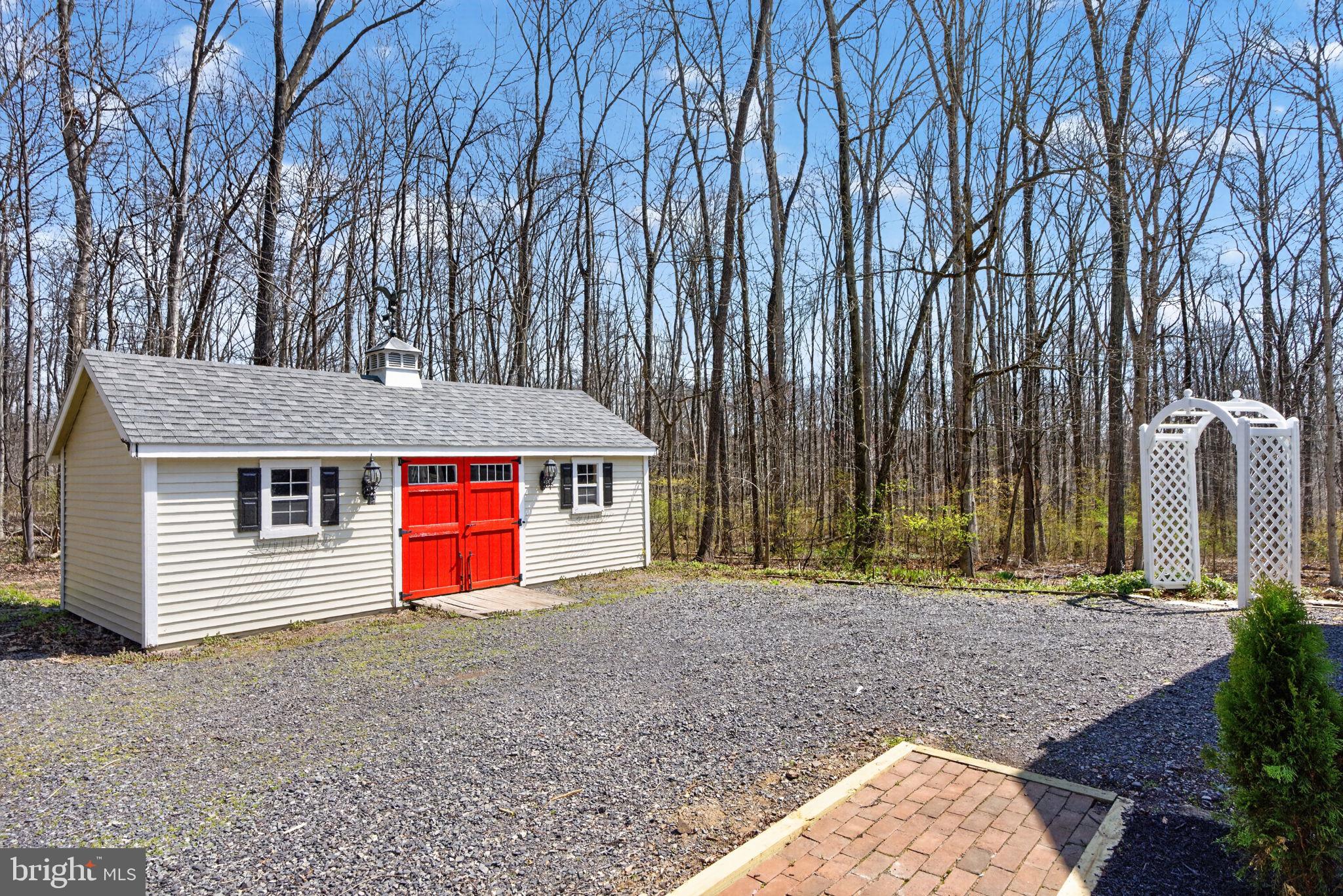 2635 Possum Hollow Road Quakertown, PA 18951 - Photo 16 of 78 a backyard of a house with portable swimming pool and basket ball court