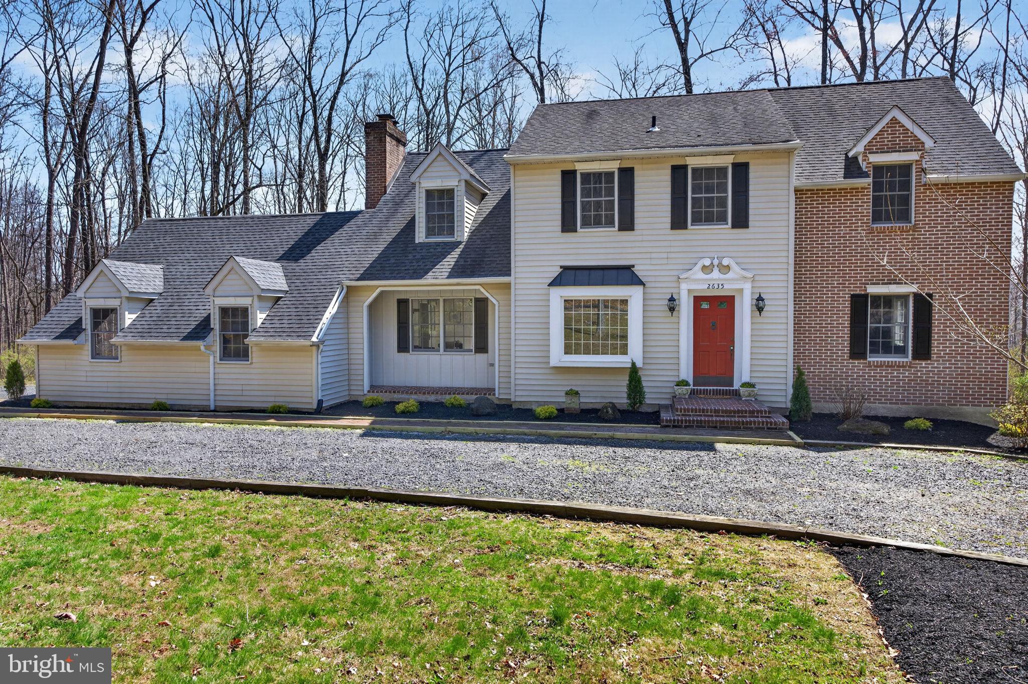 2635 Possum Hollow Road Quakertown, PA 18951 - Photo 2 of 78 a front view of a house with garden