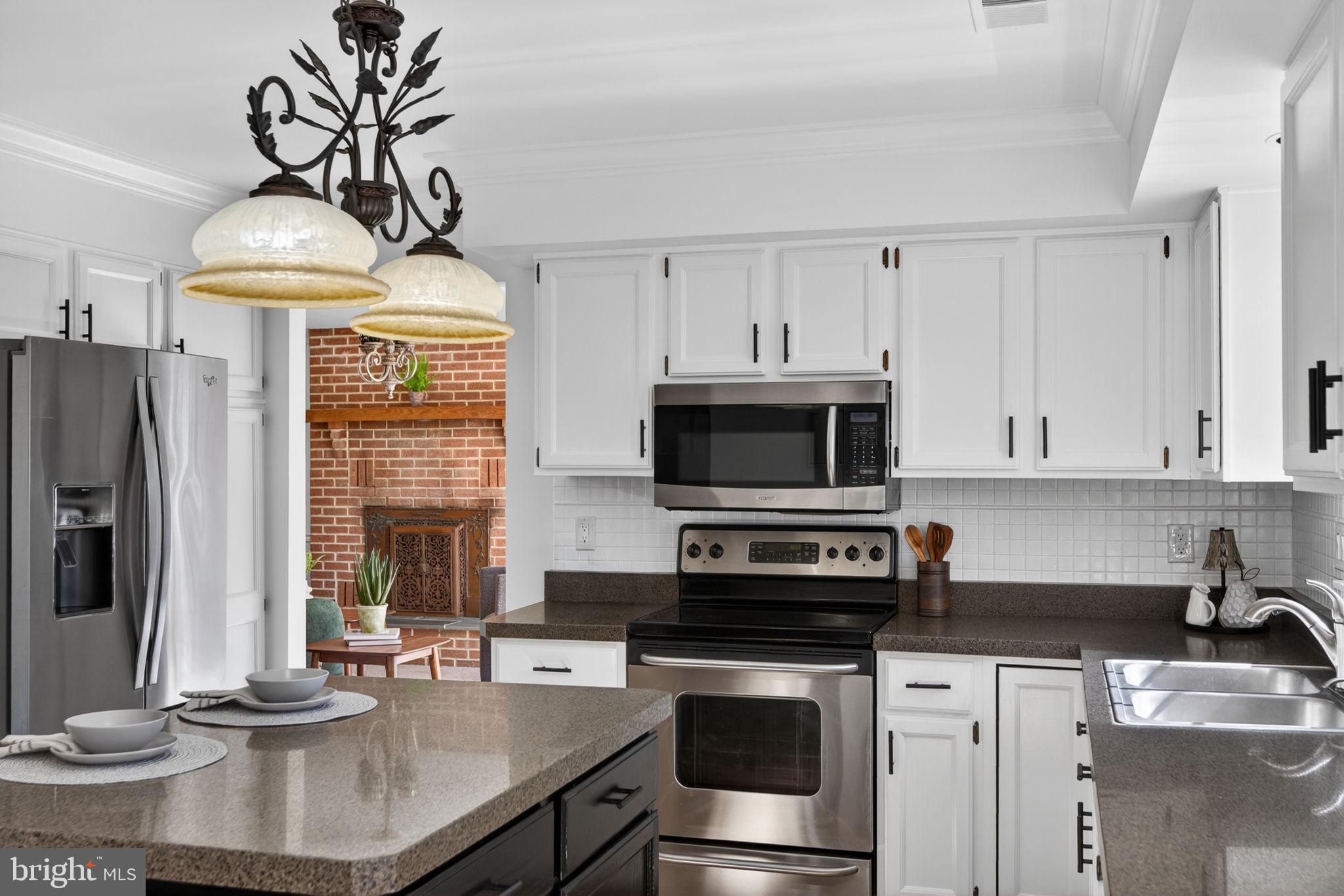 2635 Possum Hollow Road Quakertown, PA 18951 - Photo 49 of 78 a kitchen with stainless steel appliances a stove a sink and a microwave