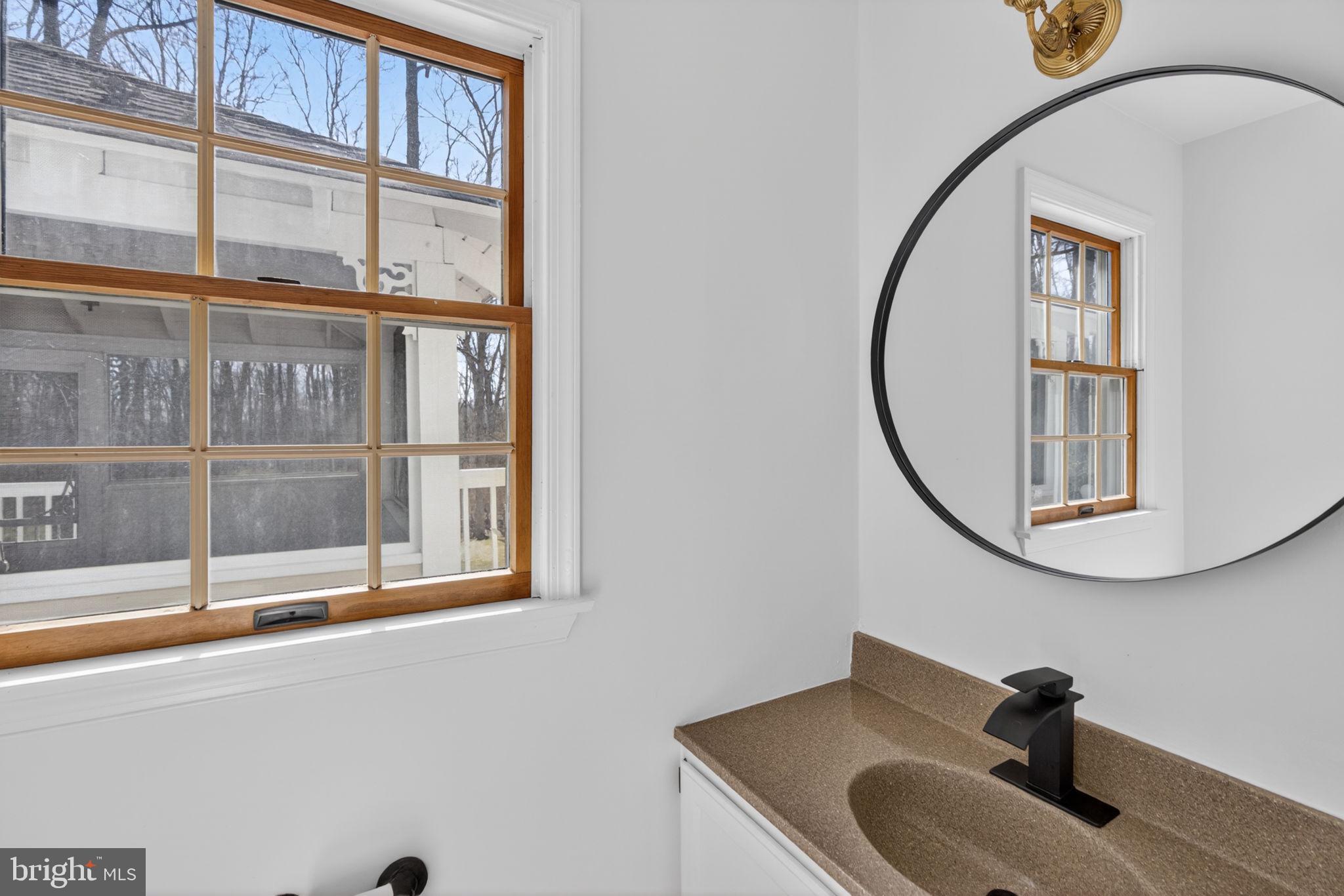 2635 Possum Hollow Road Quakertown, PA 18951 - Photo 57 of 78 a bathroom with a sink and a mirror