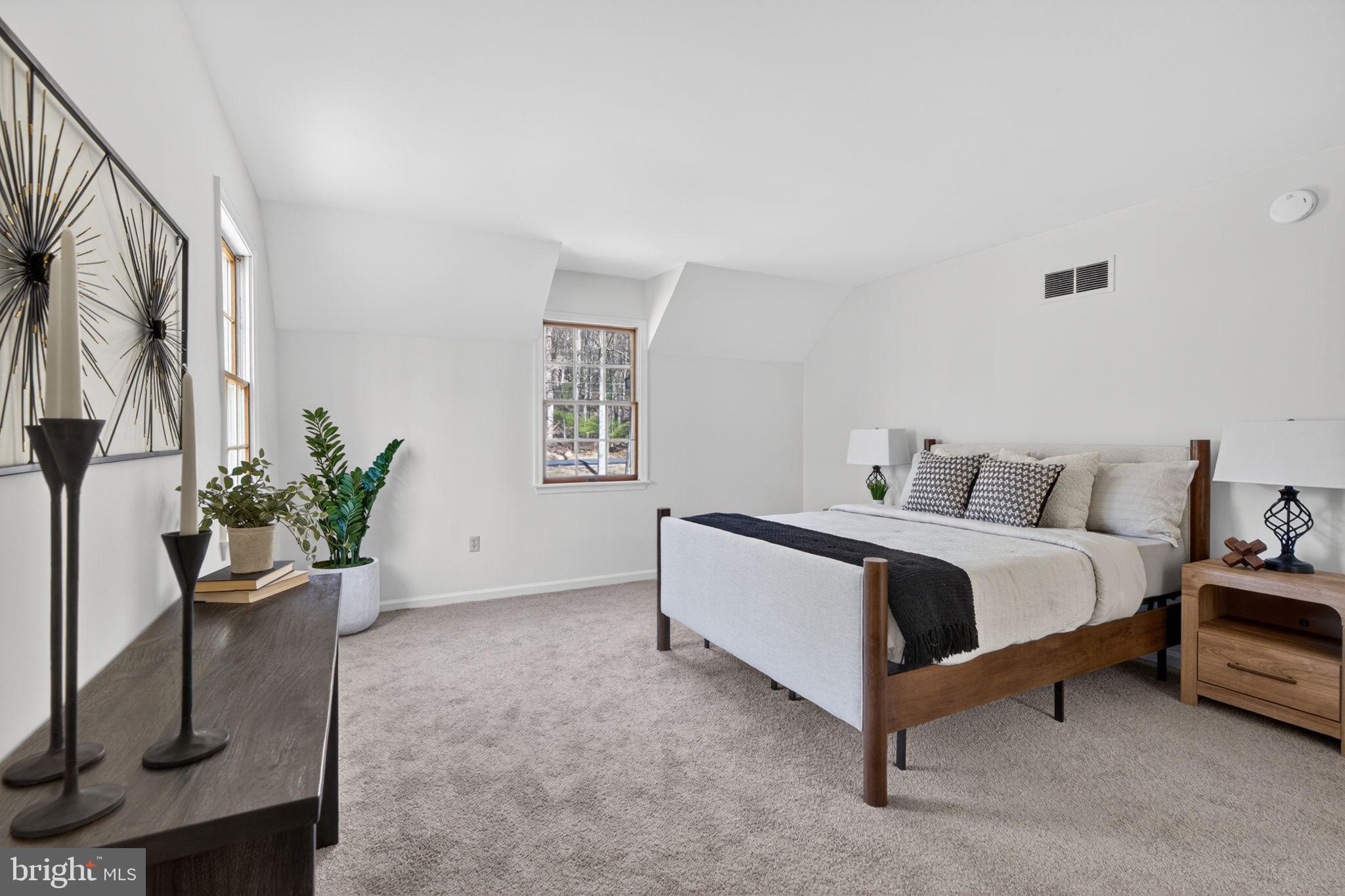 2635 Possum Hollow Road Quakertown, PA 18951 - Photo 61 of 78 a bed room with a bed and a potted plant