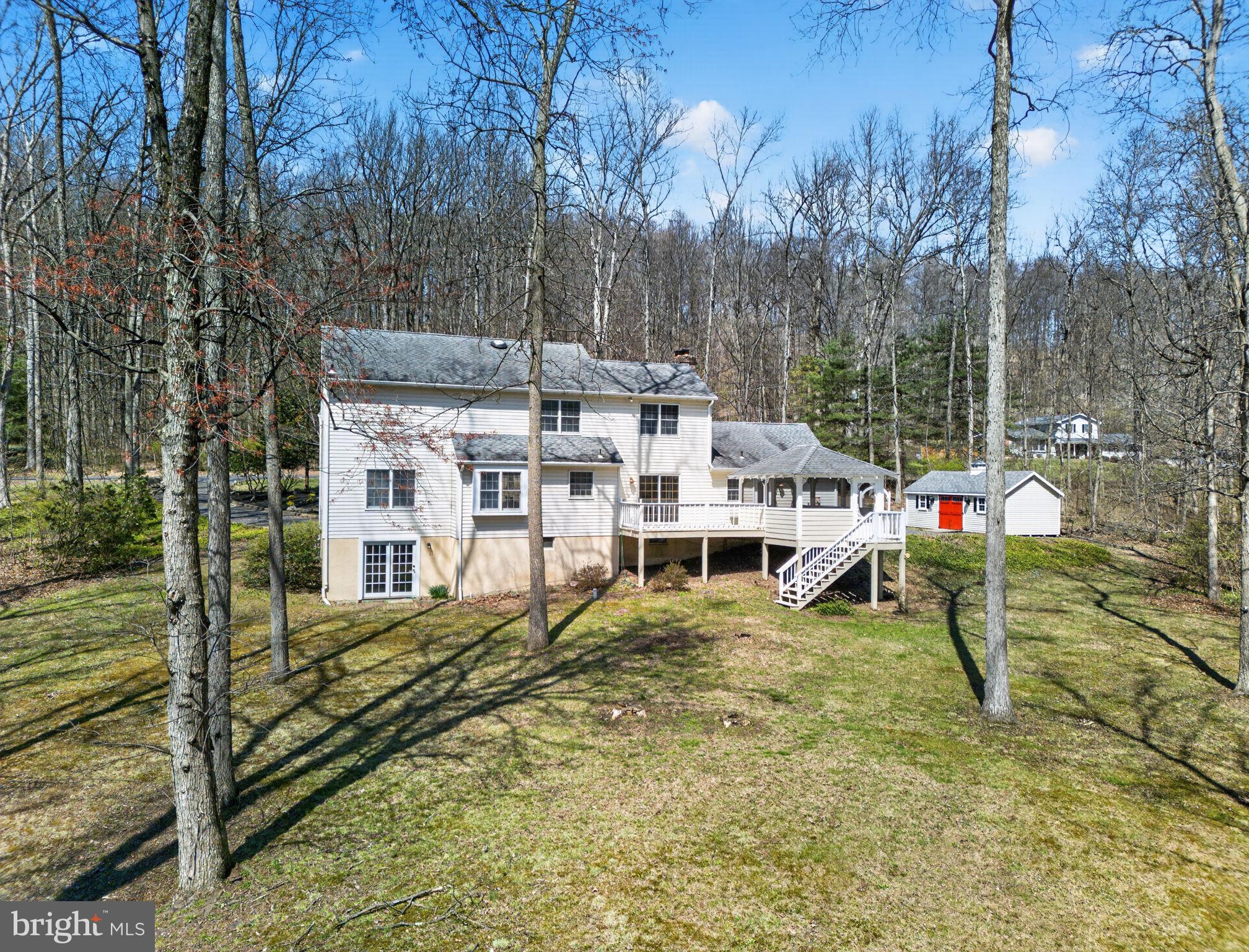 2635 Possum Hollow Road Quakertown, PA 18951 - Photo 9 of 78 a view of a house with a yard patio and deck
