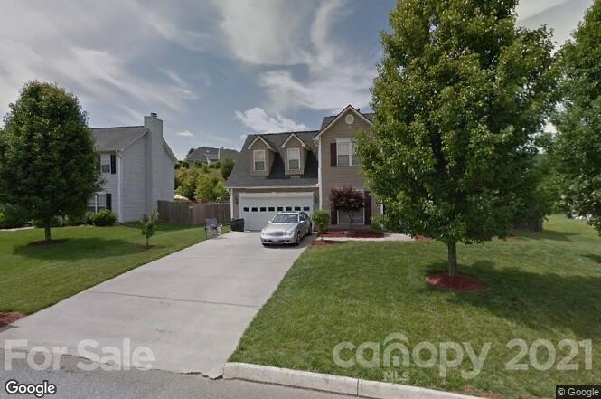 a house view with a garden space