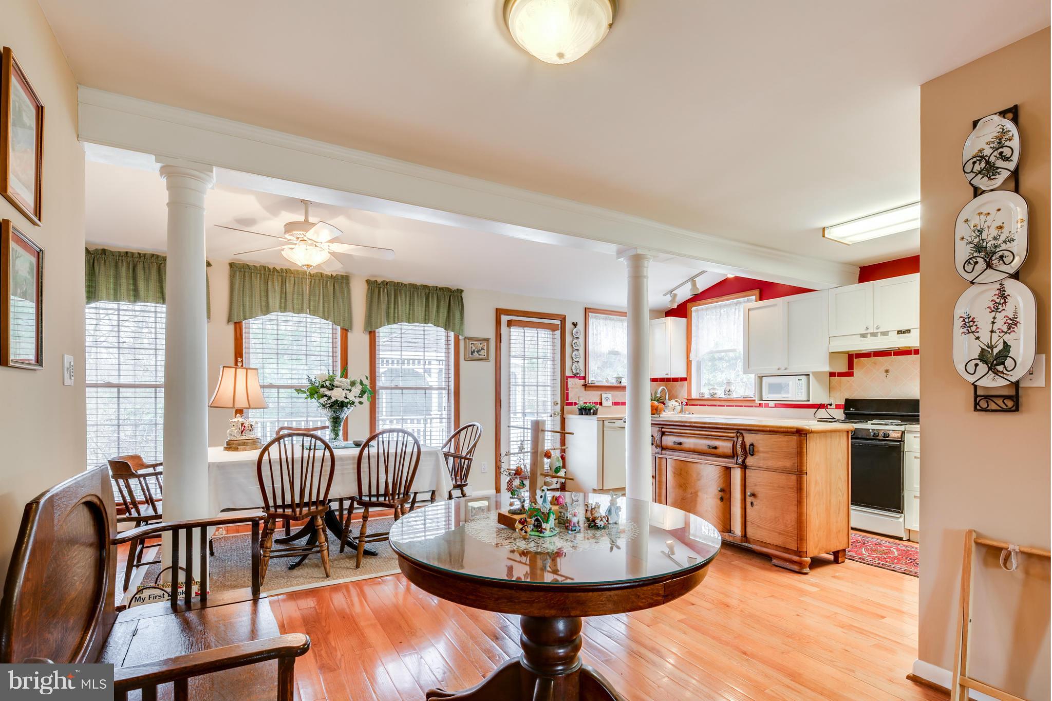 732 Warwick Road Baltimore, MD 21229 - Photo 1 of 30 a living room with furniture a large window and dining table