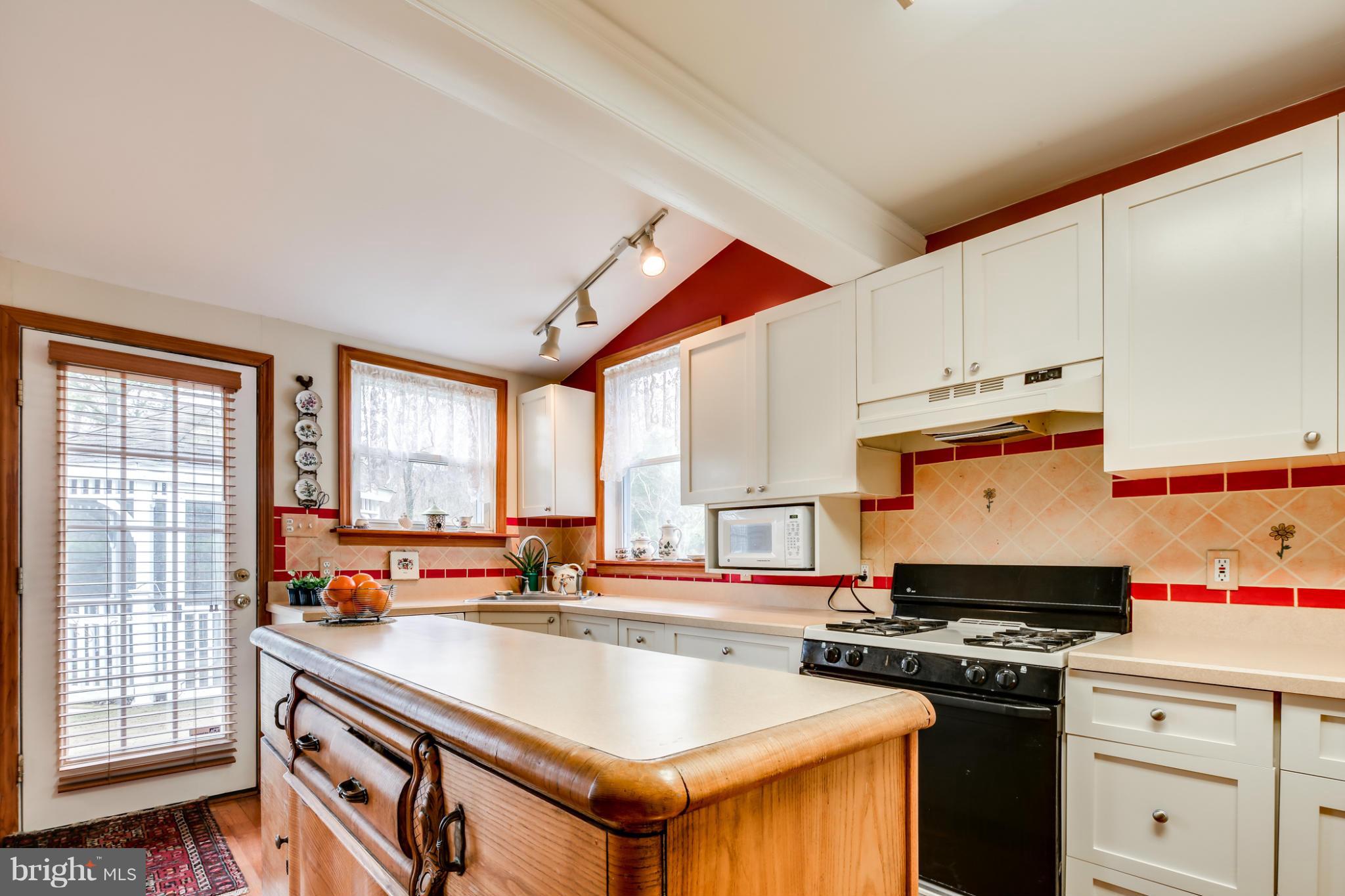 732 Warwick Road Baltimore, MD 21229 - Photo 12 of 30 a kitchen with stainless steel appliances granite countertop a stove and a sink