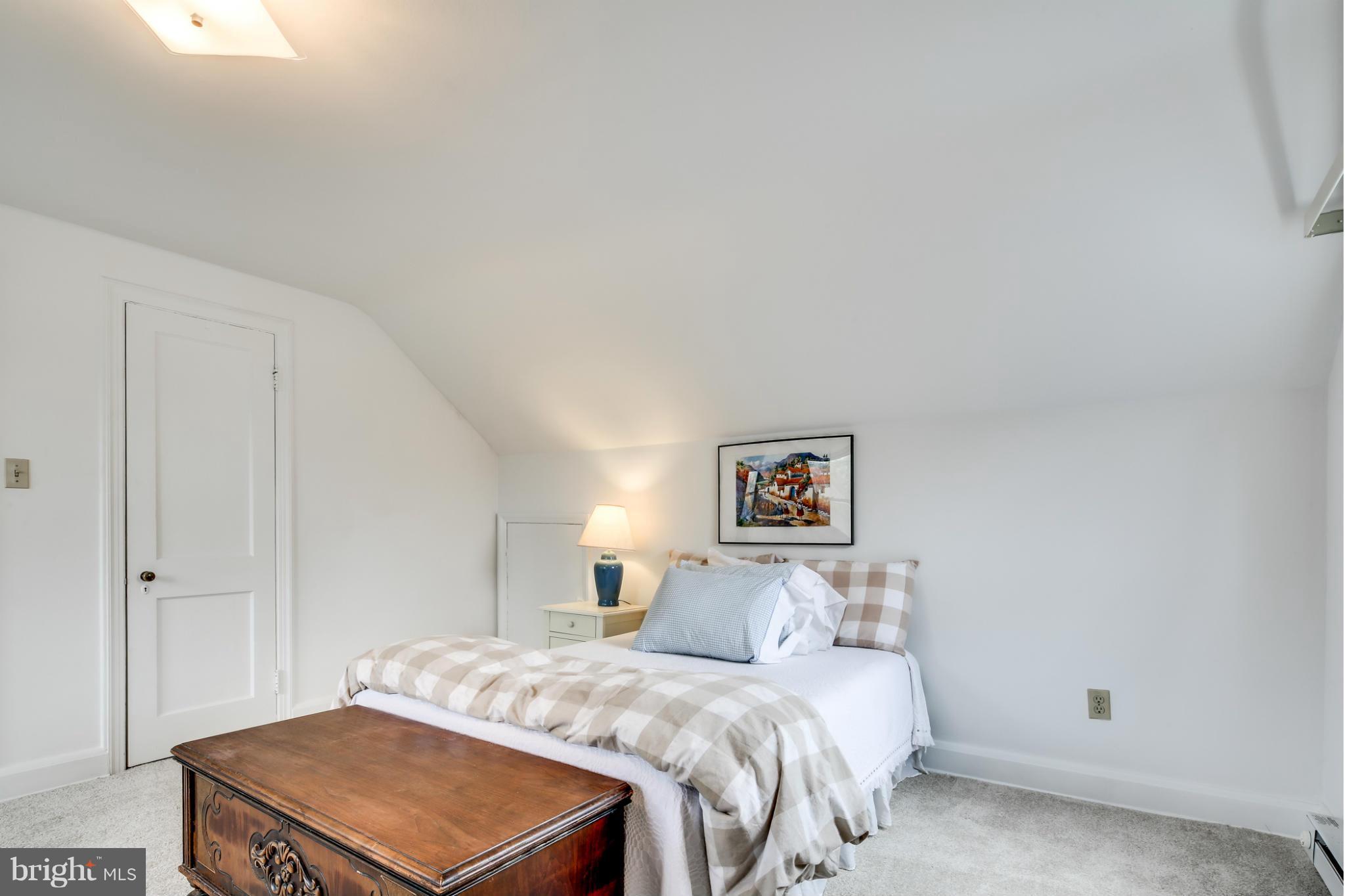 732 Warwick Road Baltimore, MD 21229 - Photo 24 of 30 a bedroom with a bed and a cabinets