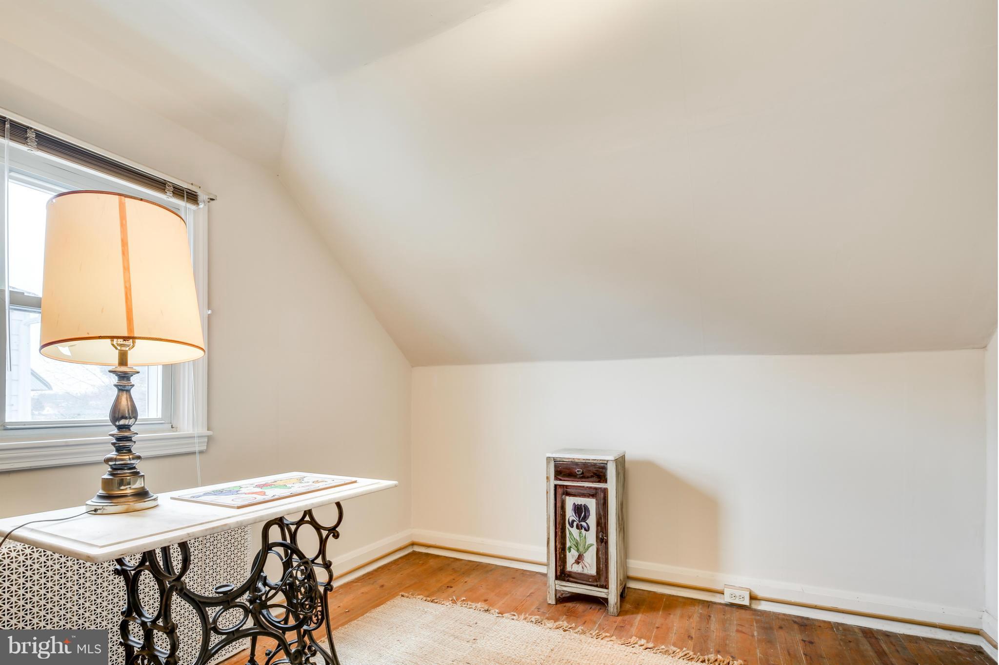 732 Warwick Road Baltimore, MD 21229 - Photo 25 of 30 a view of a workspace with furniture and a window