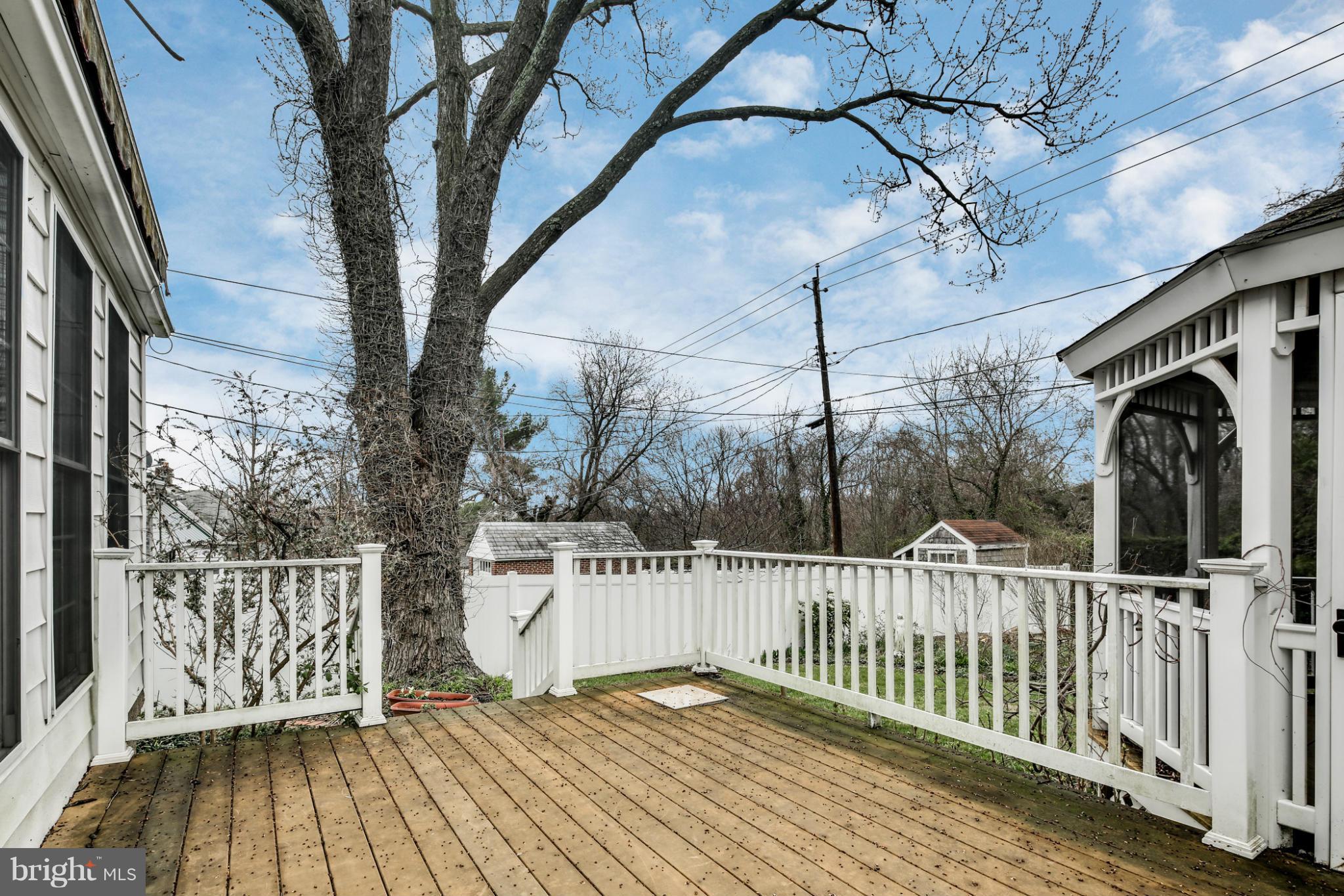 732 Warwick Road Baltimore, MD 21229 - Photo 27 of 30 a view of a wooden deck and a yard