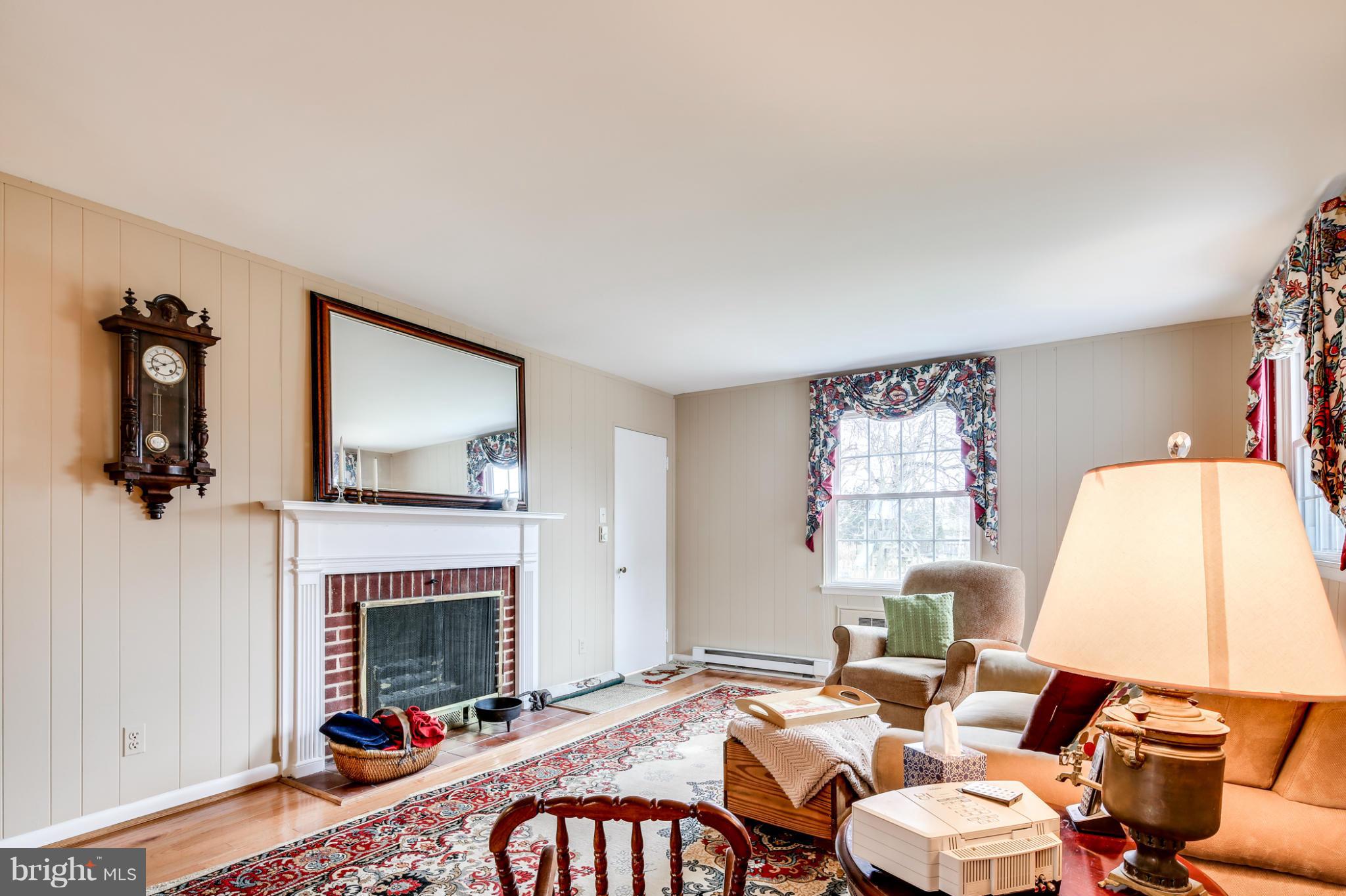 732 Warwick Road Baltimore, MD 21229 - Photo 5 of 30 a living room with furniture a fireplace and window