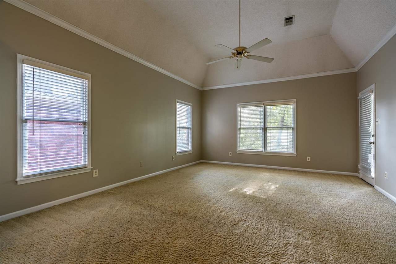 8779 Raspberry Lane Memphis, TN 38016 - Photo 14 of 25 a view of an empty room with a window