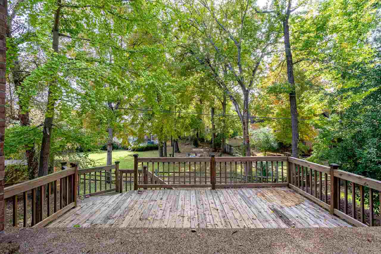 8779 Raspberry Lane Memphis, TN 38016 - Photo 23 of 25 a view of deck with wooden floor and outdoor seating