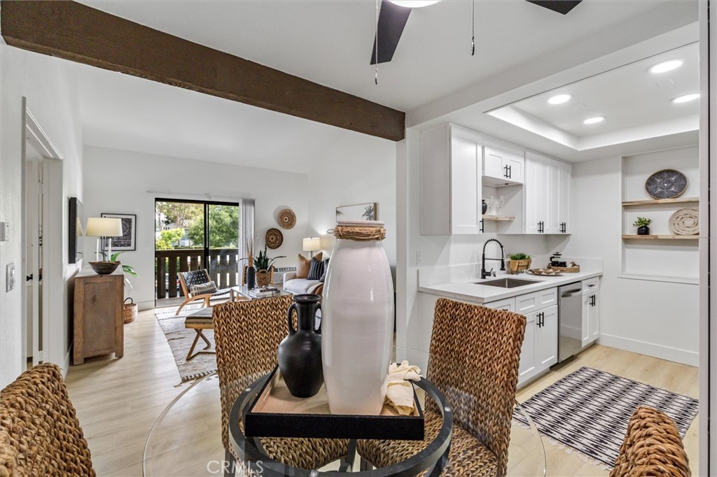 33852 Del Obispo Street, Unit 80 Dana Point, CA 92629 - Photo 11 of 36 a living room with furniture and a rug
