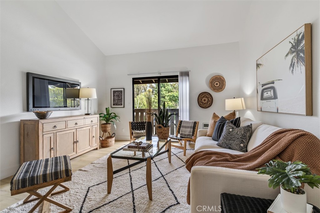 33852 Del Obispo Street, Unit 80 Dana Point, CA 92629 - Photo 12 of 36 a living room with furniture and a flat screen tv