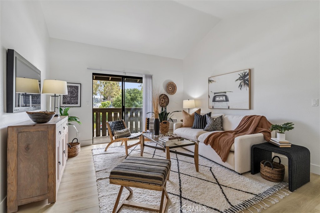 33852 Del Obispo Street, Unit 80 Dana Point, CA 92629 - Photo 14 of 36 a living room with furniture and a flat screen tv