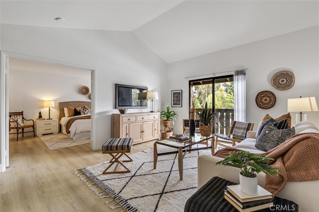 33852 Del Obispo Street, Unit 80 Dana Point, CA 92629 - Photo 19 of 36 a living room with furniture a clock and a window