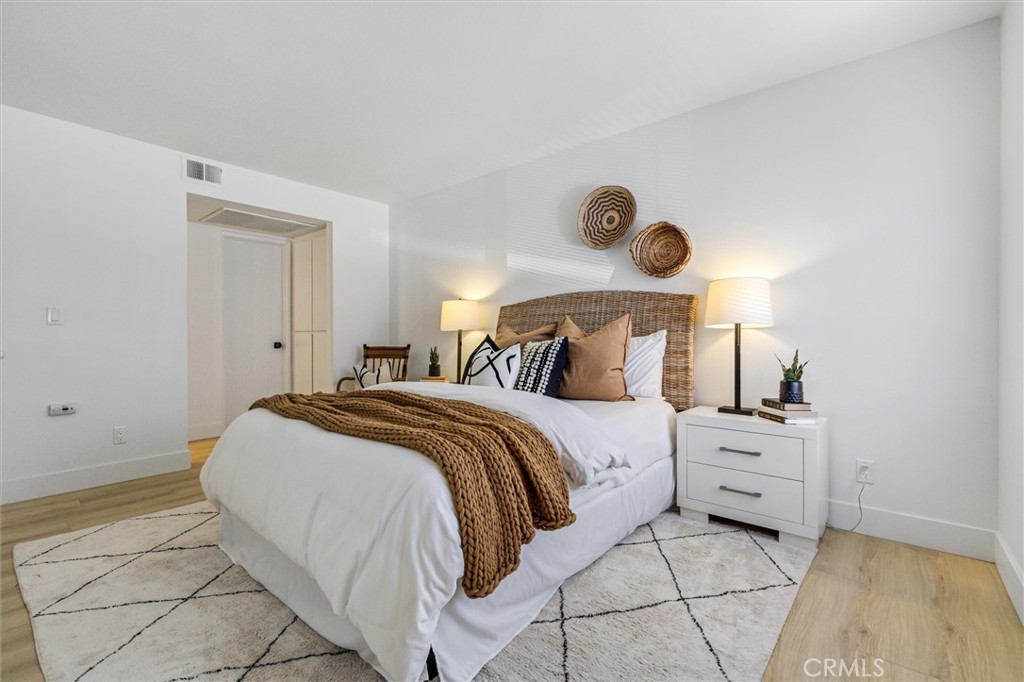 33852 Del Obispo Street, Unit 80 Dana Point, CA 92629 - Photo 21 of 36 a bedroom with a bed and a window