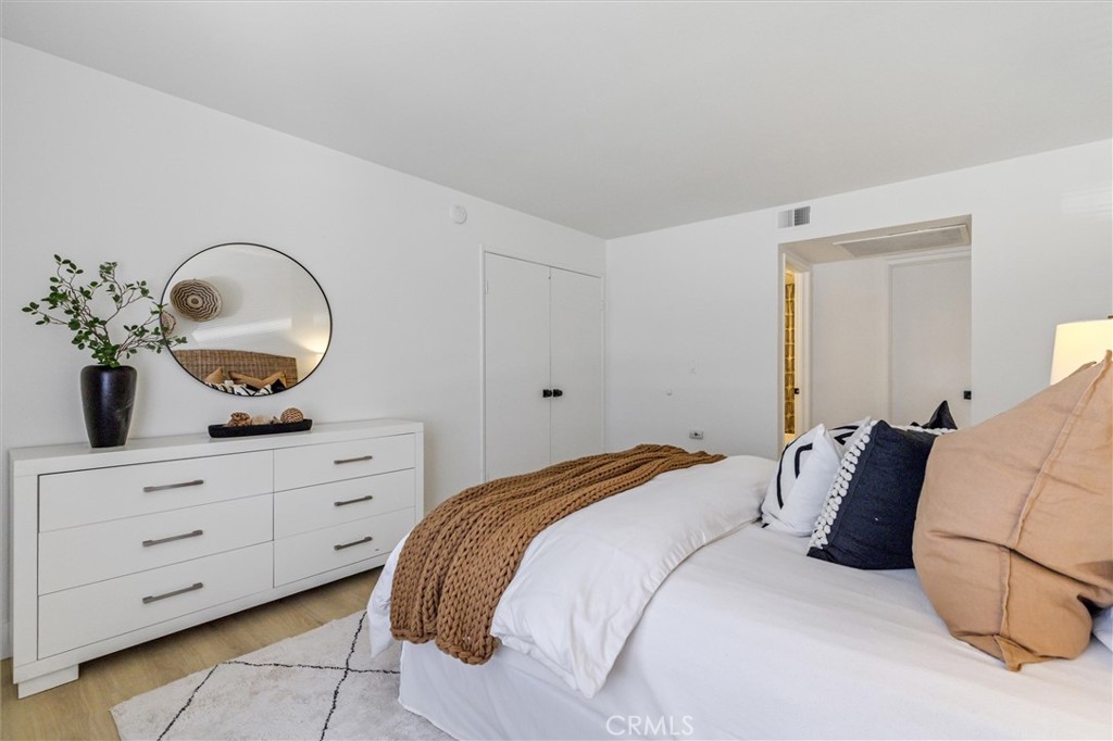 33852 Del Obispo Street, Unit 80 Dana Point, CA 92629 - Photo 22 of 36 a bedroom with a bed and a dresser