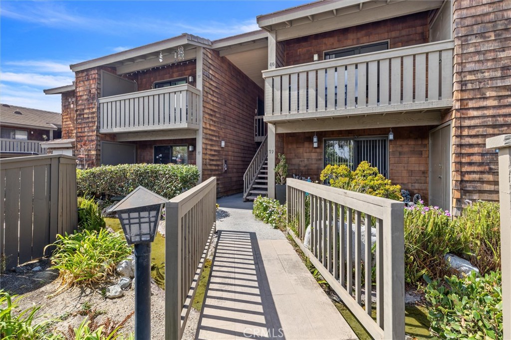 33852 Del Obispo Street, Unit 80 Dana Point, CA 92629 - Photo 27 of 36 a view of a house with wooden deck