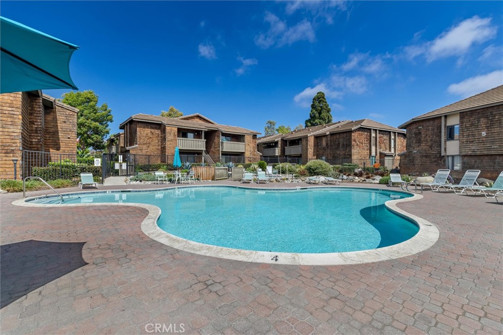 33852 Del Obispo Street, Unit 80 Dana Point, CA 92629 - Photo 32 of 36 a view of a house with outdoor space and swimming pool