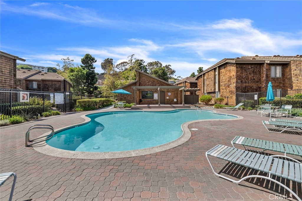 33852 Del Obispo Street, Unit 80 Dana Point, CA 92629 - Photo 33 of 36 a view of swimming pool with outdoor seating and city view