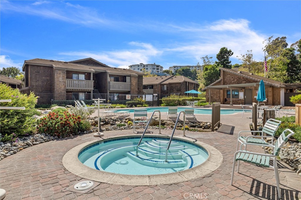 33852 Del Obispo Street, Unit 80 Dana Point, CA 92629 - Photo 34 of 36 a house view with a swimming pool