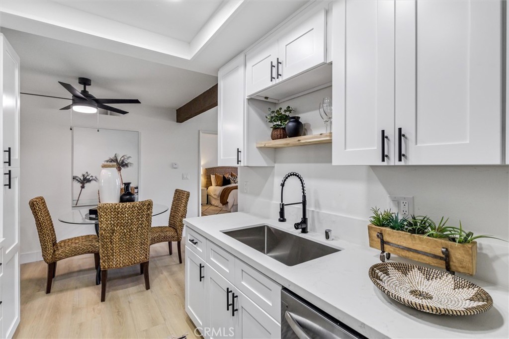 33852 Del Obispo Street, Unit 80 Dana Point, CA 92629 - Photo 8 of 36 a kitchen with a table and chairs