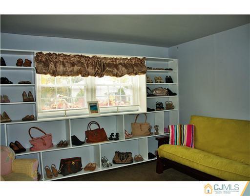 3 Timber Road Edison, NJ 08820 - Photo 14 of 24 a living room with a couch and a large window