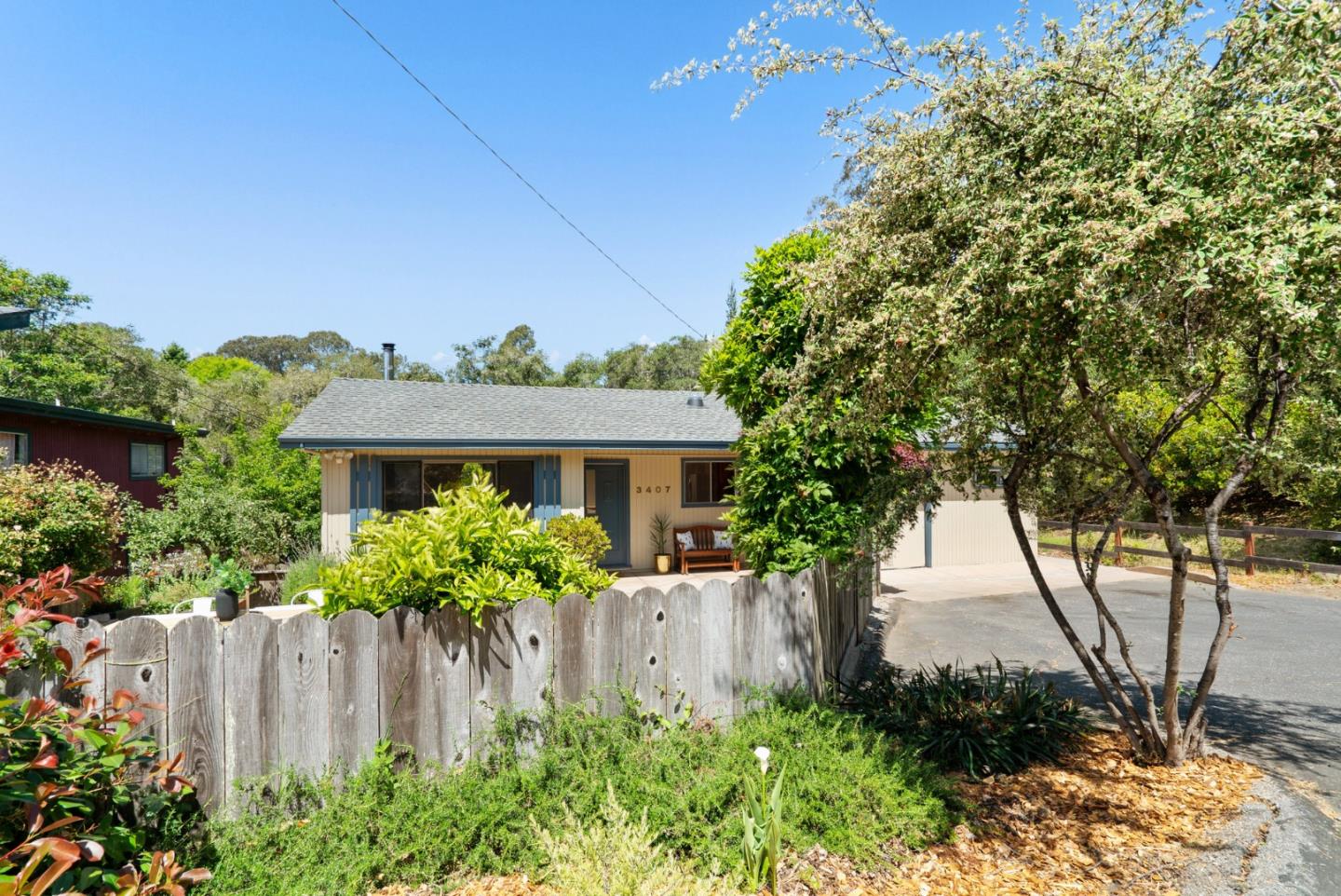 3407 Maplethorpe Lane Soquel, CA 95073 - Photo 1 of 52 a front view of a house with a yard