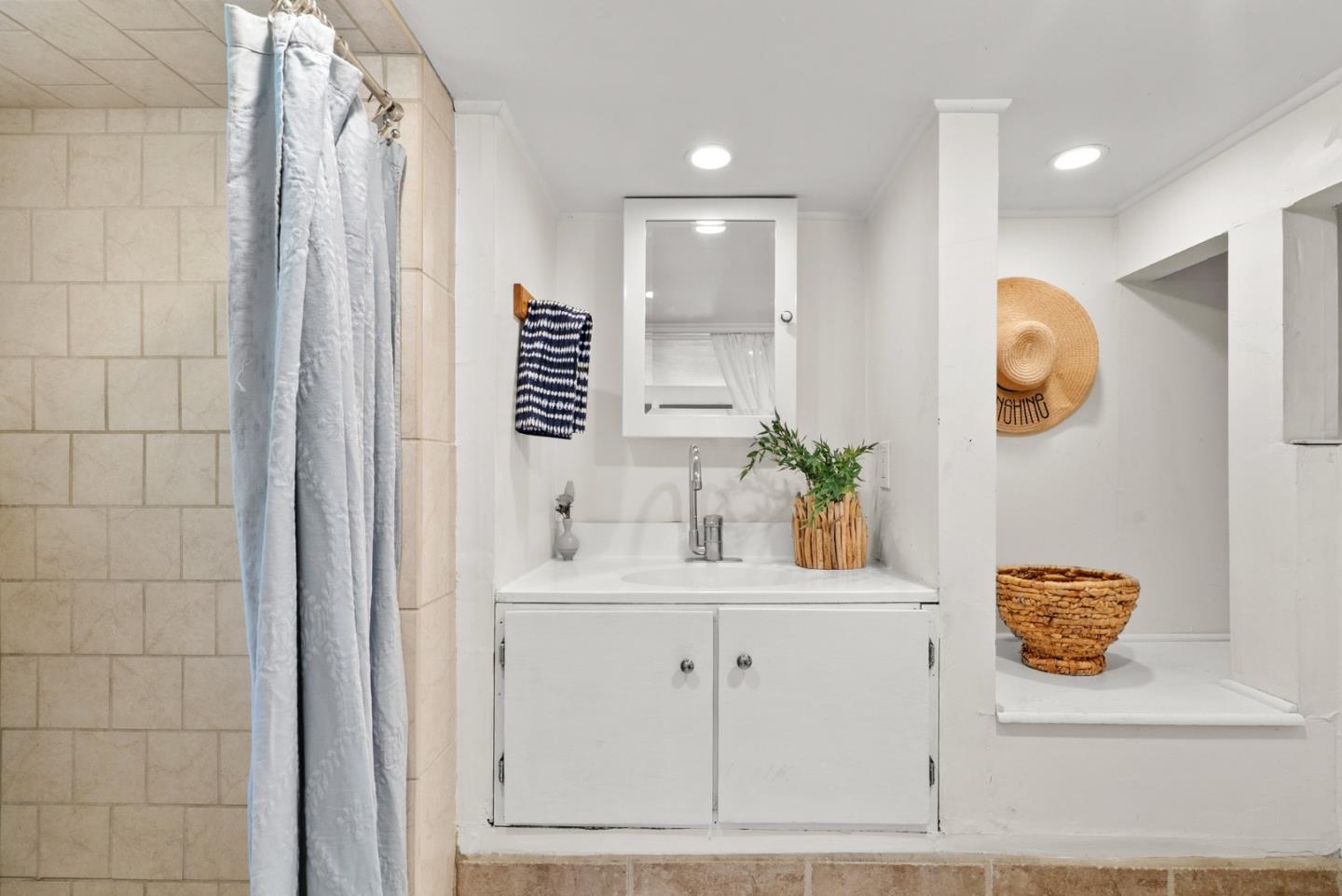 3407 Maplethorpe Lane Soquel, CA 95073 - Photo 42 of 52 a bathroom with a sink a vanity and mirror
