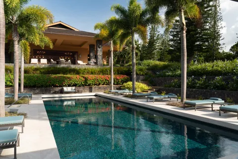 a lobby with furniture and a gate