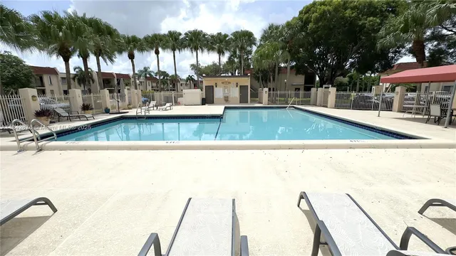 a view of a swimming pool with a patio
