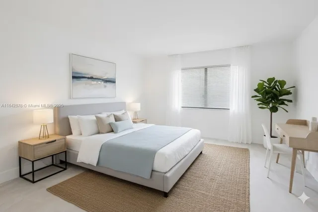 a bedroom with a bed and a potted plant