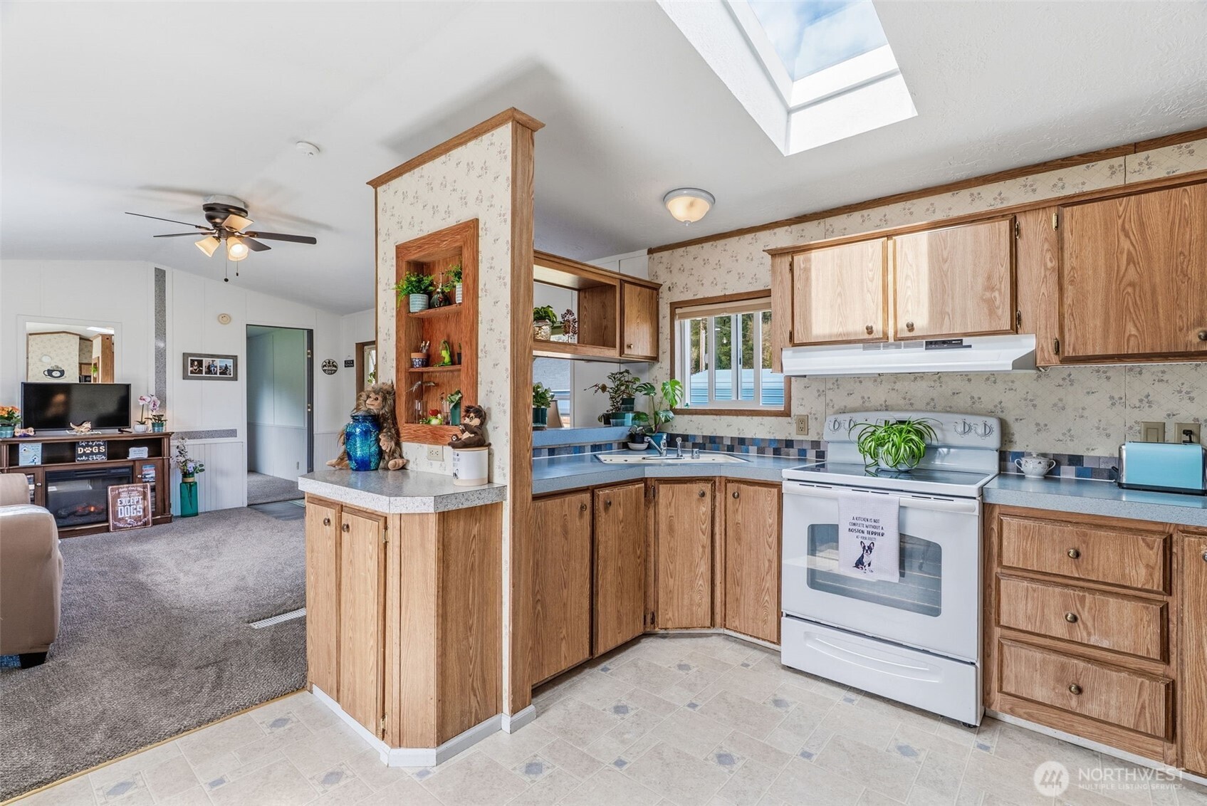 1006 Northwest Mill Street Winlock, WA 98596 - Photo 12 of 22 a kitchen with stainless steel appliances granite countertop a stove a sink and a refrigerator