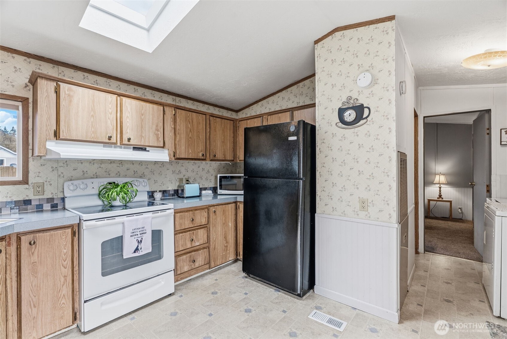 1006 Northwest Mill Street Winlock, WA 98596 - Photo 13 of 22 a kitchen with stainless steel appliances granite countertop a refrigerator and a stove