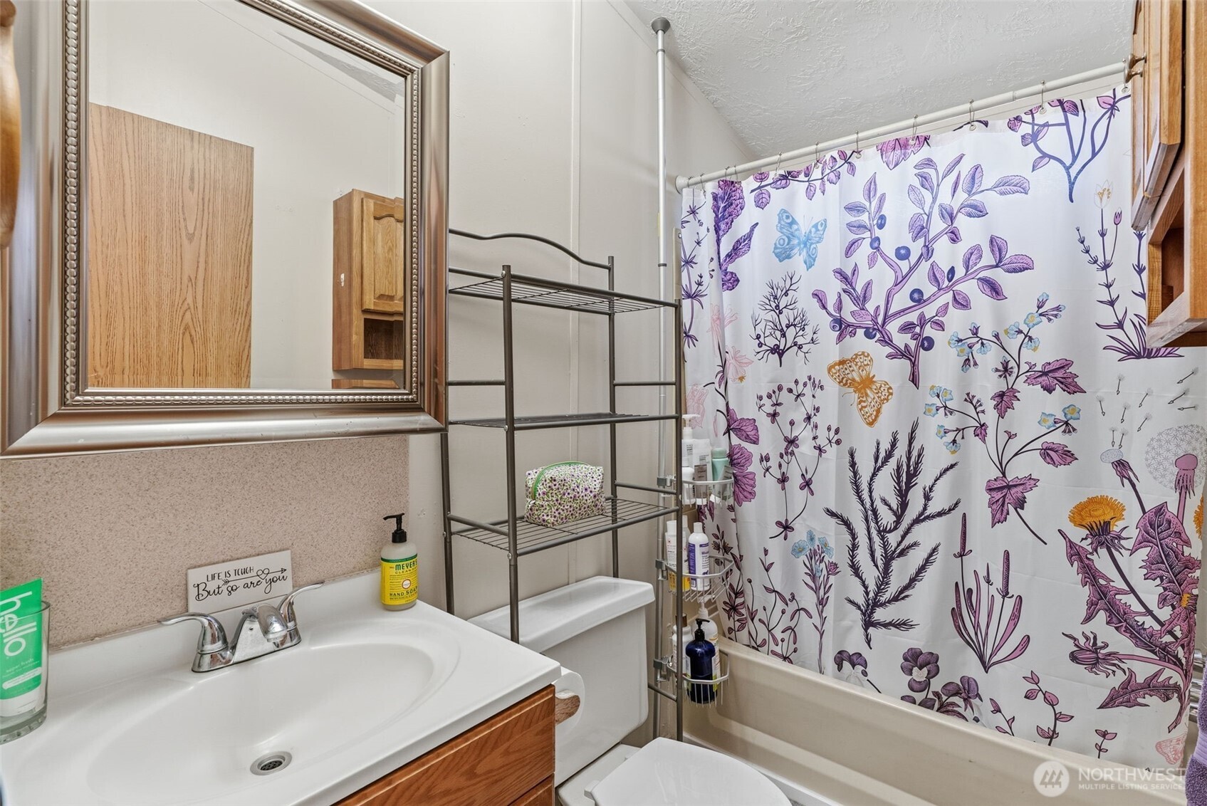 1006 Northwest Mill Street Winlock, WA 98596 - Photo 15 of 22 a bathroom with a sink toilet and shower