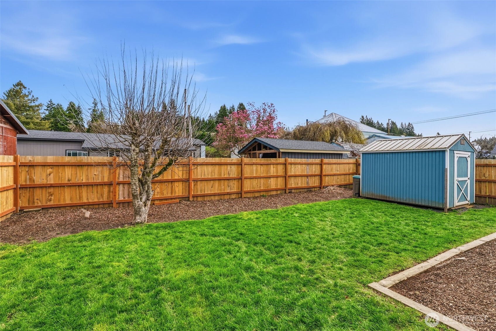 1006 Northwest Mill Street Winlock, WA 98596 - Photo 21 of 22 a view of a backyard with a garden