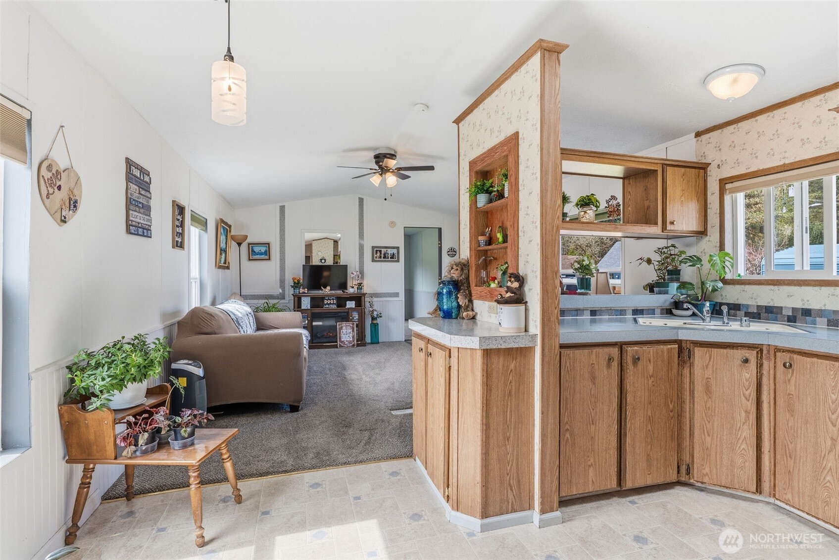 1006 Northwest Mill Street Winlock, WA 98596 - Photo 9 of 22 a living room with furniture a chandelier and a dining table