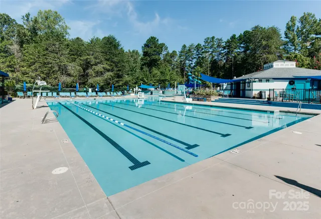 a childrens park with lots of trees in the background