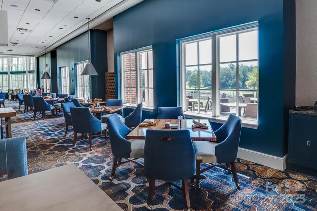 a dining room with tables and chairs