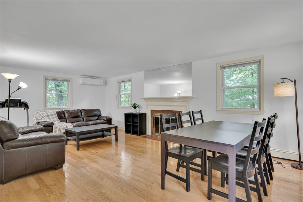 32 Dewey Road Lexington, MA 02420 - Photo 8 of 32 a living room with furniture a dining table and chairs