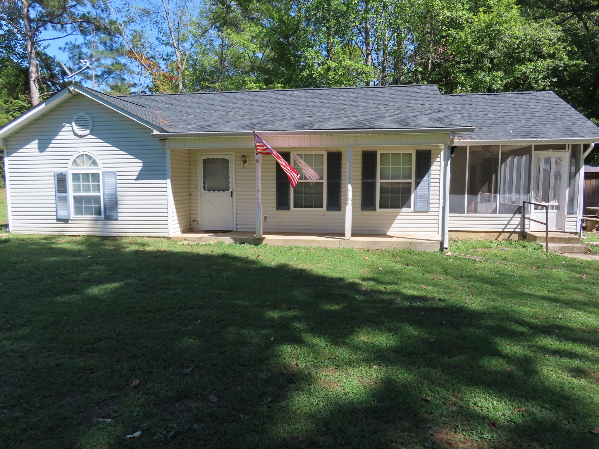 511 Bumpas Road Lawrenceburg, TN 38464 - Photo 1 of 14 a front view of a house with a yard and garden